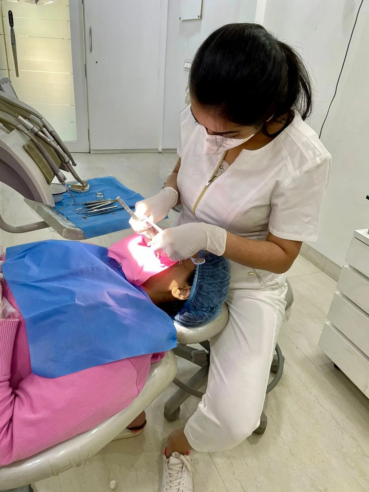 Dental professional providing care in the Dental Works treatment room